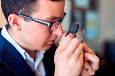 Man Inspecting a Diamond Image