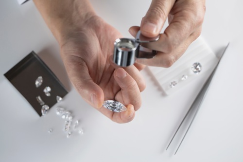 Person inspecting a diamond image